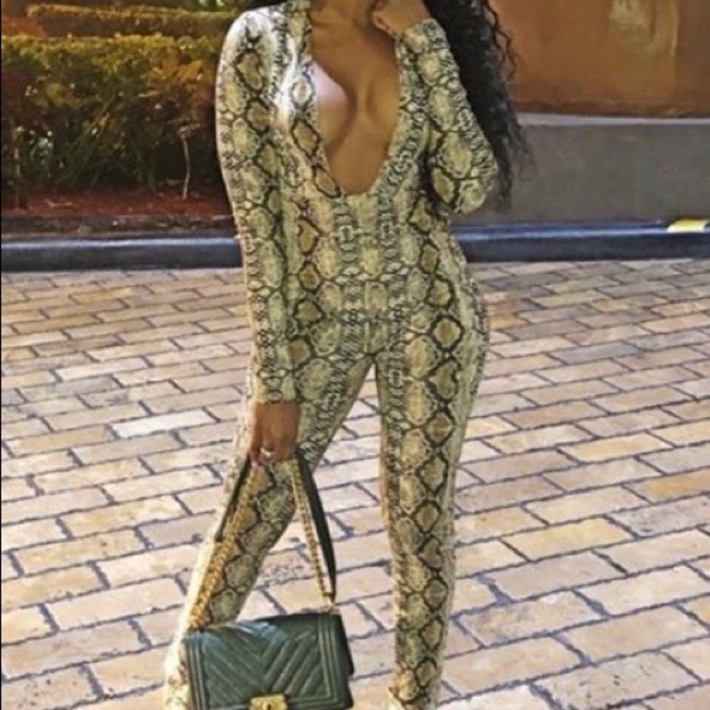 SELLING A SNAKESKIN PRINT JUMPSUIT.